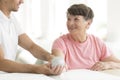 Patient holding spiked rehabilitation ball