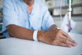 Patient with IV drip and hand tag Royalty Free Stock Photo