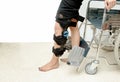 Patient on knee brace support try to walk training,Rehabilitation treatment