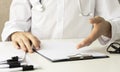 Patient listening intently to a female doctor explaining patient symptoms or asking a question as they discuss together