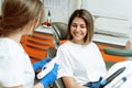 The patient looks at how to properly brush his teeth. The dentist shows clearly on the artificial jaw Royalty Free Stock Photo