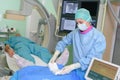 Patient lying on mri machine while doctor operating it