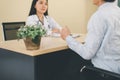 Patient man talking with professional psychologist,Therapist conducting a consultation and counseling at hospital Royalty Free Stock Photo