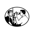 Patient and Optician or Optometrist with Eye Test Equipment Testing for Eye Exam Retro Black and White Royalty Free Stock Photo