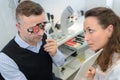 patient on optometrist eye test with eye chart Royalty Free Stock Photo