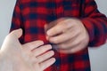 A patient with Parkinson`s disease has trembling hands. Tremor of the extremities in various diseases. Close-up of a shivering ma