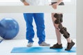 Patient and physiotherapist at the appointment in orthopedic clinics Royalty Free Stock Photo