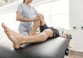 Patient at the physiotherapy doing physical exercises with his therapist Royalty Free Stock Photo