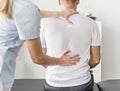 Patient at the physiotherapy doing physical exercises with his therapist Royalty Free Stock Photo