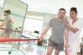 Patient at physiotherapy doing physical exercises using flexi bar Royalty Free Stock Photo