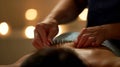 A patient with psoriatic arthritis receives acupuncture treatment in a quiet dimlylit room. The acupuncturist carefully