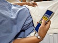 The patient pushing the remote control of the Fully Electric Automatic Hospital Bed Royalty Free Stock Photo