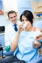 Patient rinsing mouth after treatment Royalty Free Stock Photo