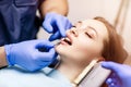 Patient`s teeth shade with samples for bleaching treatment. Royalty Free Stock Photo