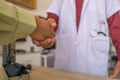 The patient shake hands the doctor to express his gratitude to the doctor for treating the sickness Royalty Free Stock Photo