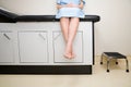 Patient sitting on treatment couch