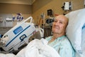 Patient Sitting Up in Modern Hospital Room