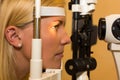 Patient at slit lamp of optician or optometrist