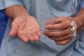 Patient taking a tablet of medicine