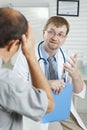 Patient telling symptoms to doctor Royalty Free Stock Photo