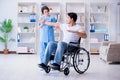 The patient undergoing rehabilitation recovery programme with doctor Royalty Free Stock Photo