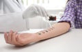 Patient undergoing skin allergy test at light table Royalty Free Stock Photo