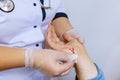 Patient visiting hand injury doctor wipes the blood