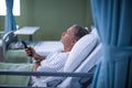 Patient watching television on the bed Royalty Free Stock Photo