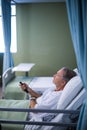 Patient watching television on the bed Royalty Free Stock Photo