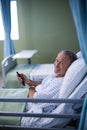 Patient watching television on the bed Royalty Free Stock Photo