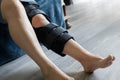 Patient wearing knee brace support after injury and surgery. Healthcare and medical concept Royalty Free Stock Photo