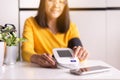 Patient woman using blood pressure & heart rate monitors in yourself at home Royalty Free Stock Photo