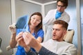 Patient with workpeople looking x-ray of teeth Royalty Free Stock Photo