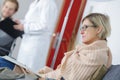 Patients in doctors waiting room Royalty Free Stock Photo