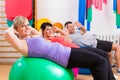 Patients at physiotherapy on training balls Royalty Free Stock Photo