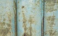 Patina blue and rusted metal panel with steel rods grunge background texture Royalty Free Stock Photo