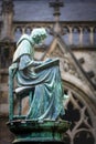 Statue of a writing monk at the medieval Dom cathedral, Utrecht, the Netherlands