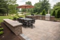 patio with built-in grill and seating for outdoor dining