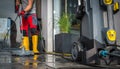 Patio Concrete Bricks Surface Cleaning Using Powerful Pressure Washer