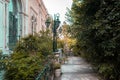 Patio or courtyard of a vintage building with trees, bushed and potted plants Royalty Free Stock Photo