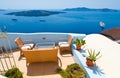 Patio with flowers in Fira on the island of Thira (Santorini), Greece. Royalty Free Stock Photo