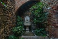 Patio with fountain and plants. Detail of the interior of the Alcazaba arab castle in Malaga