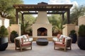 a patio with an outdoor fireplace and plush lounge chairs Royalty Free Stock Photo