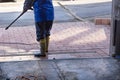 Pavement cleaning with high pressure washer Royalty Free Stock Photo