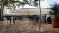 Patio of a restaurant looking out at traffic and downtown Lakeland Florida