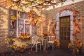 Patio. Shutters of the window and brick walls decorated with aut Royalty Free Stock Photo