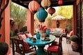 patio with sitting area, dining table and hanging lanterns