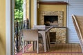 A patio with a table and chairs on a brick patio Royalty Free Stock Photo