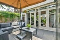 a patio with two couches and a coffee table