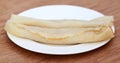 Patishapta Pitha on a white plate